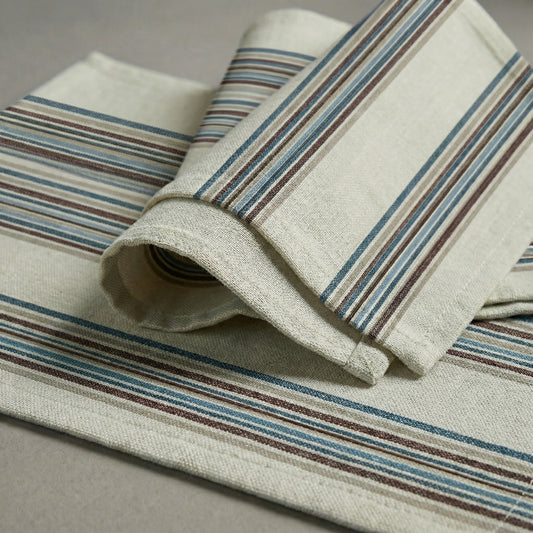 Rolled-up fabric with striped pattern on a neutral background handwoven cotton