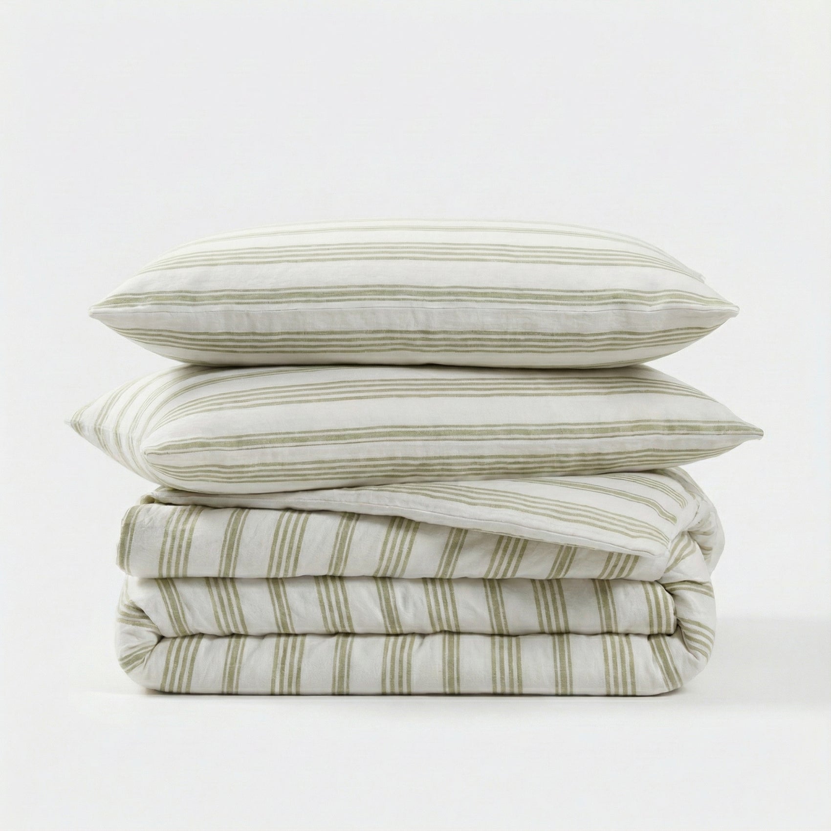Stack of sage striped bedding with two pillows on a white background