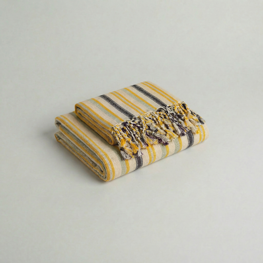 Folded atelier orea handwoven cotton towel set in yellow, mint green and purple