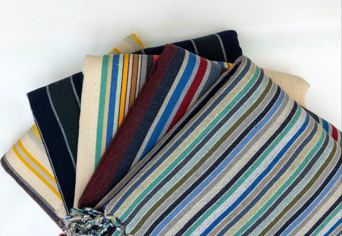 Collection of atelier orea striped pestemal towels on a white background