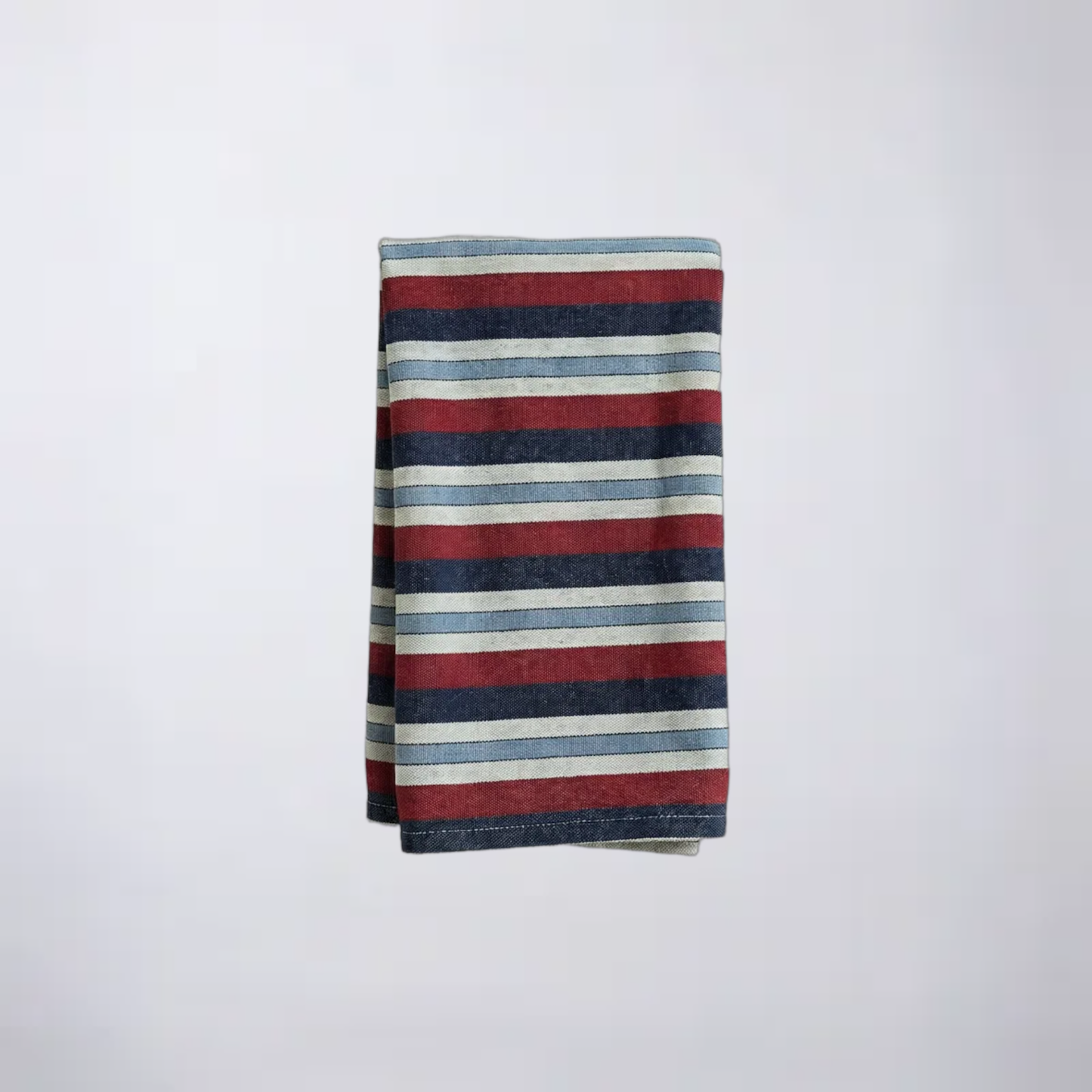 Striped napkin with maroon, blue, and white colors on a light gray background